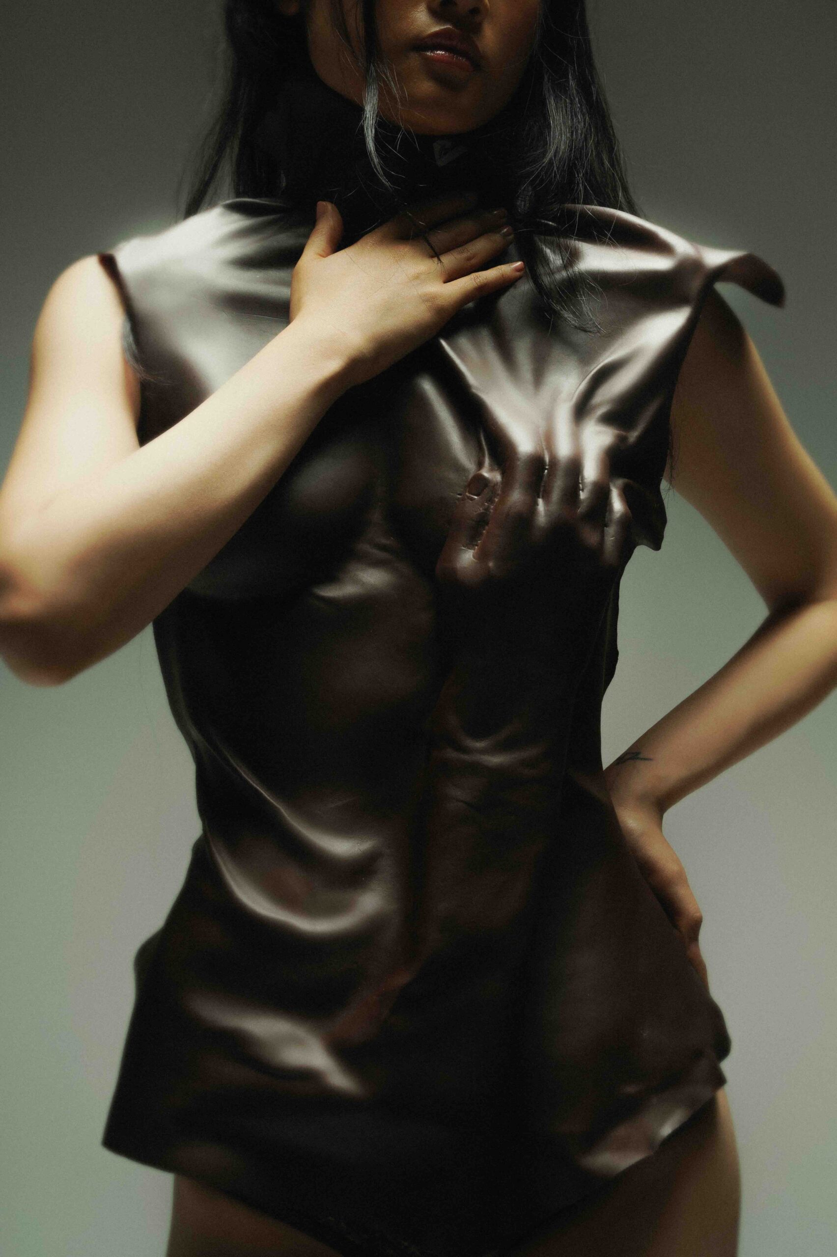 Editorial photograph of Pauline Blind’s Blasphemous Bodies collection at Amsterdam Fashion Week, featuring models in veils, layered garments, and symbolic accessories.