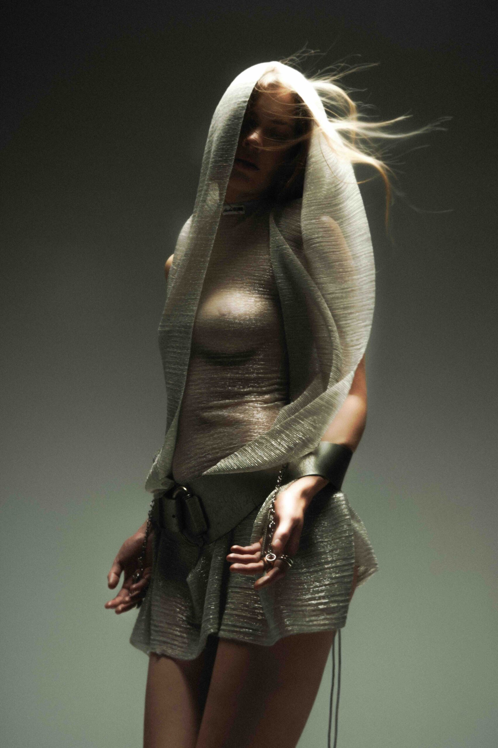 Editorial photograph of Pauline Blind’s Blasphemous Bodies collection at Amsterdam Fashion Week, featuring models in veils, layered garments, and symbolic accessories.