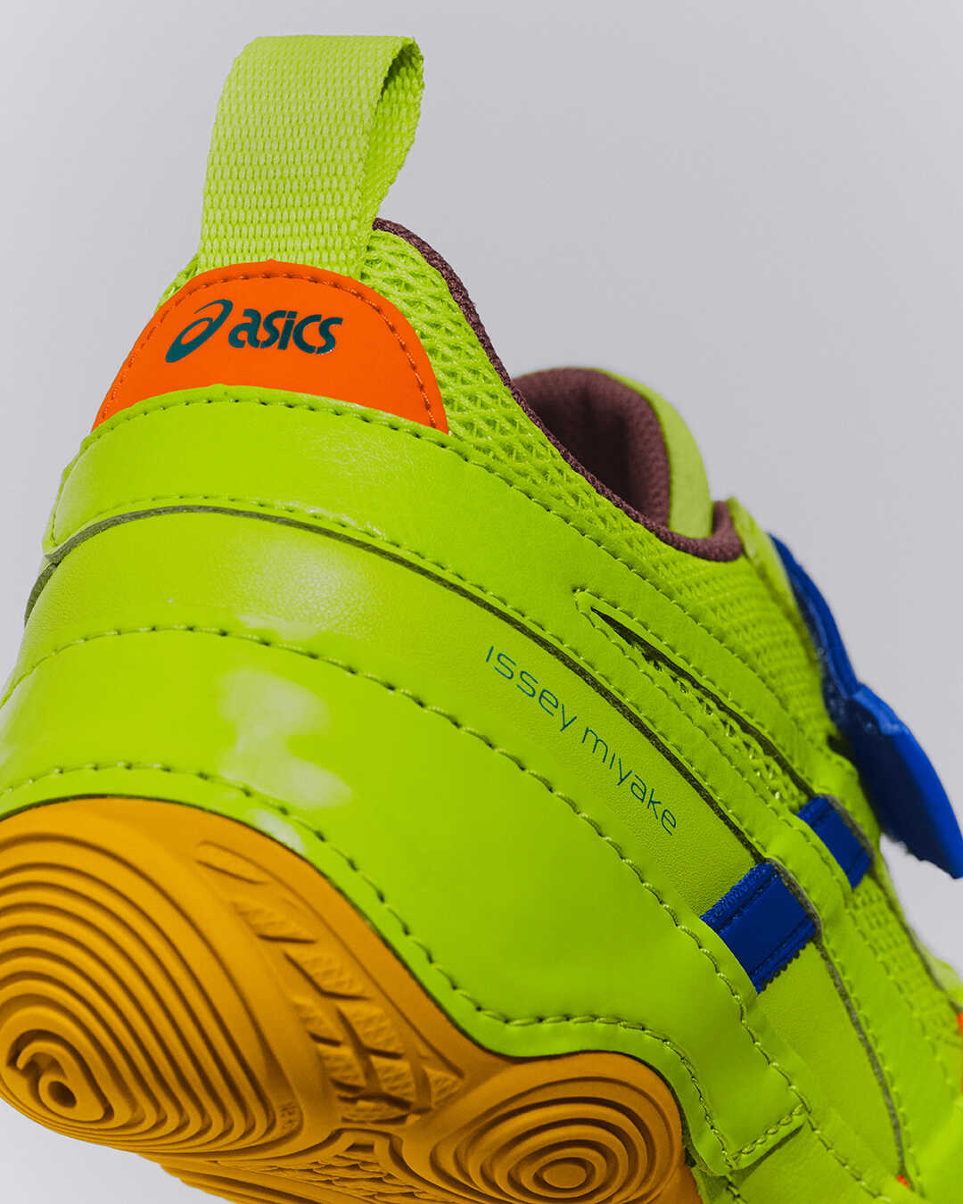 close up of the back details of the sneaker, showing both the ASICS and Issey Miyake logos